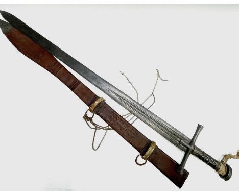 A Sudanese Kaskara sword, with fullered 93.5cm blade, steel cross hilt and white metal grip and pommel, the tooled leather sc