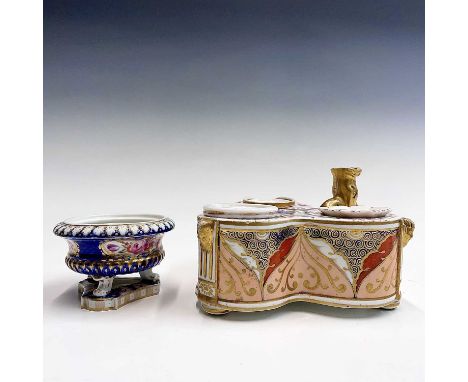 An English porcelain triple inkstand, circa 1820, painted in an Imari palette and of trefoil shape, the pen holder modelled a