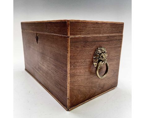 A late George III partridgewood and crossbanded tea caddy with twin lion mask handles and divided interior. Width 26.5cm.Prov