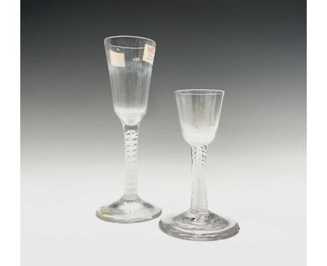 A mid 18th century cordial glass, the bucket bowl with traces of gilding on a white opaque spiral and gauze twist stem, heigh