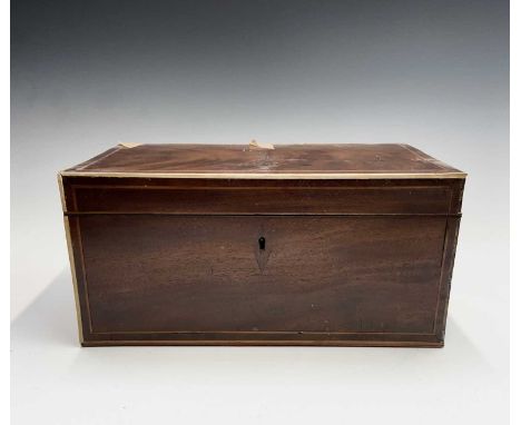 A George III mahogany, boxwood and ivory strung rectangular tea caddy, the interior with two lidded compartments and receptac