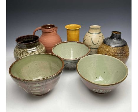 Three studio pottery bowls with red oxide resist decoration, together with four studio pottery vases and a C H Brannan Barum 