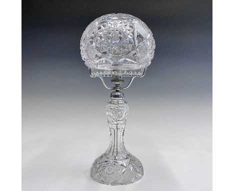 A cut glass table lamp and shade, with hobnail and foliate cut decoration, height 39cm.Condition report: There is one hard-to