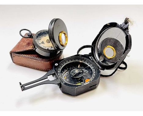 A lacquered brass military handheld compass, early 20th century, in a leather case, height 9cm, together with a black lacquer