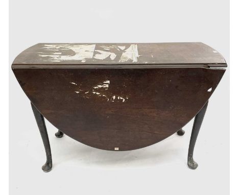 An early George III mahogany drop leaf oval dining table, raised on cabriole legs with pad feet. Height 72cm, width 150cm, de