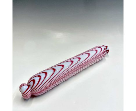 A Nailsea type opaque white and pink glass rolling pin, 19th century, length 38cm.