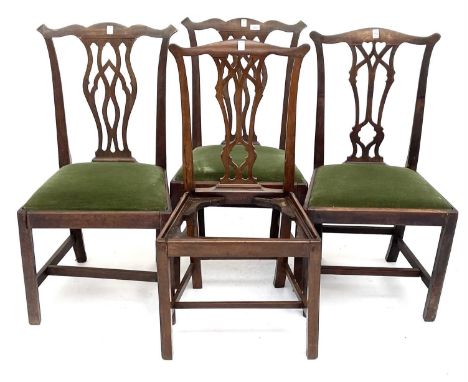 A pair of late George III mahogany dining chairs in the Chippendale style, together with another similar pair (4).Provenance: