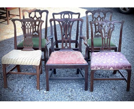 A pair of George III mahogany dining chairs of Chippendale design, with carved top rails and pierced splats, together with fo