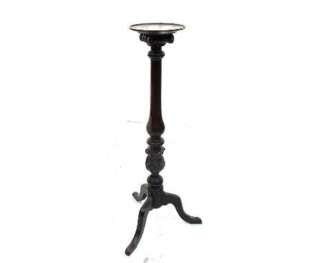 A 19th century mahogany torchere, the baluster column with acanthus carved base and tripod foot. Height 111.5cm, diameter of 