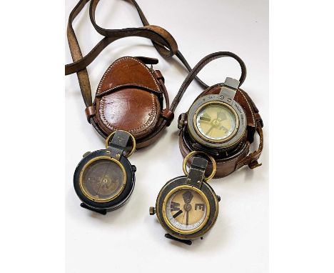 A WWI marching compass, by F Barker &amp; Son, London, dated 1918, in a Wolfsky &amp; Co leather case, another, by J. Hicks, 