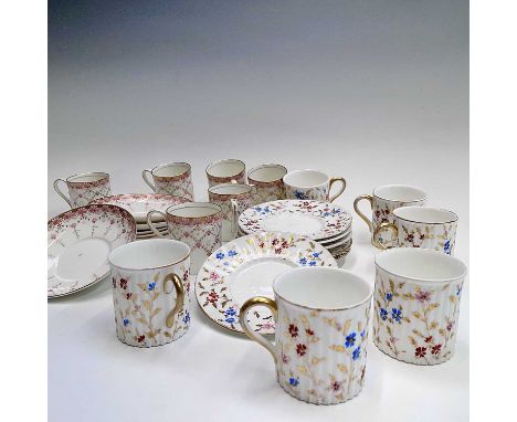 A set of six Royal Worcester coffee cans and saucers, with pink floral and gilt decoration, together with a set of six Wedgwo