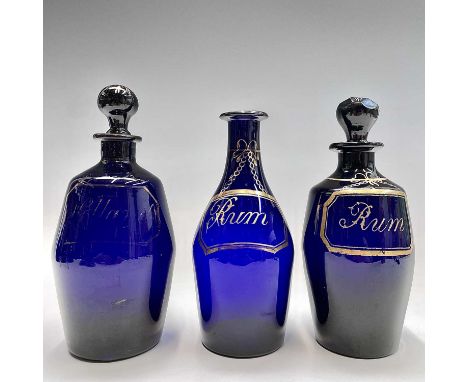A George III Bristol blue barrel-shaped rum decanter, the faceted stopper inscribed 'R', the decanter inscribed on faux label