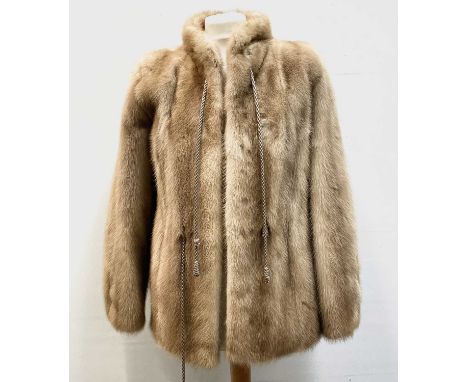 A ladies blonde mink short-length fur coat, bearing label 'M. Michaels Exeter &amp; Torquay' approximate size 8.Condition rep