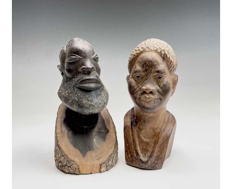 An African carved wood head and shoulders bust of a bearded man, height 24.5cm, together with another African portrait bust (