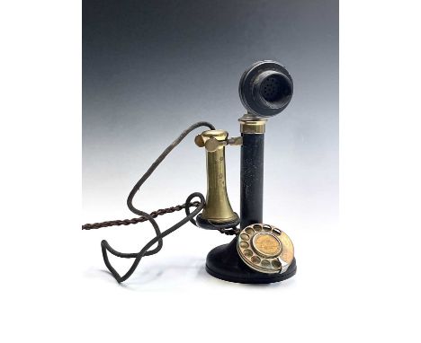 A vintage brass, bakelite and painted metal candlestick telephone, No 2/H23 255, height 31cm.