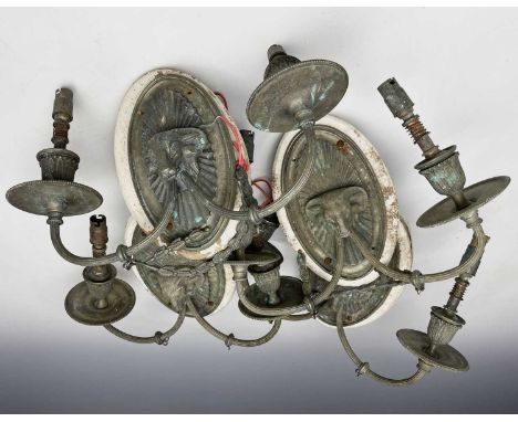 A set of four Neo-Classical style brass twin branch light fittings with applied rams heads, width 30cm.Condition report: Desc
