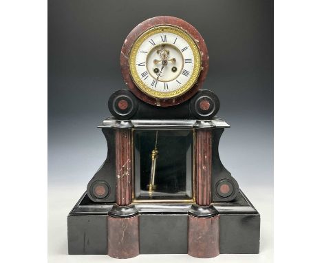 A Victorian black slate and red marble mantel clock, with large mercury filled pendulum, 48cm, width 39.5cm.