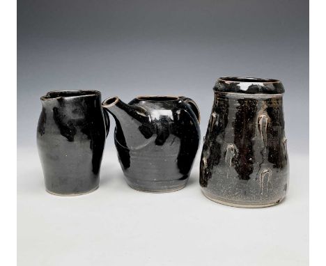 A Jeremy Leach Lowerdown Pottery tenmoko glazed jug, vase and teapot (lacks lid)