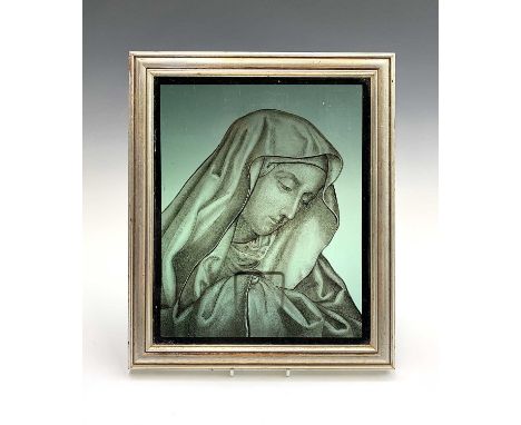 A hand-painted glass panel in the 17th century style, head and shoulder portrait of the Virgin Mary, in modern silver frame. 