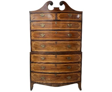 A Regency mahogany and satinwood banded bow front chest on chest, with swan neck pediment, the upper part with two short and 