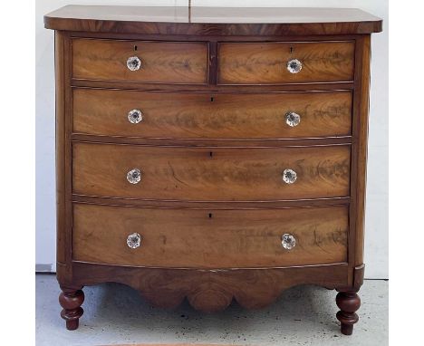 A Victorian mahogany bow front chest of two short and three long drawers, with moulded glass handles, on turned feet, height 