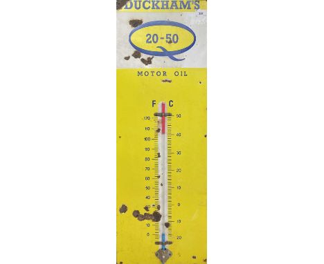 An Enamel Duckham's Motor Oil enamel on metal advertising sign with thermometer, with replacement thermometer, height 92cm. 