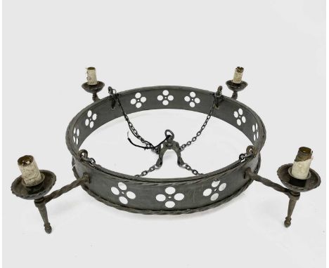 An Arts and Crafts Gothic style electrolier, with pewter finish and with four candle sconce style light fittings, diameter 80