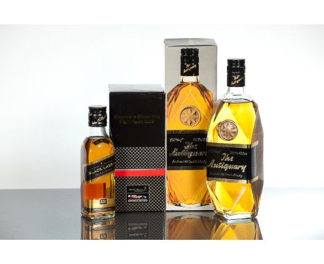 THE ANTIQUARY DE LUXE
Blended Scotch Whisky by J. & W. Hardie. 26 2/3 fl oz, 70° Proof, in carton.
JOHNNIE WALKER SINGAPORE G