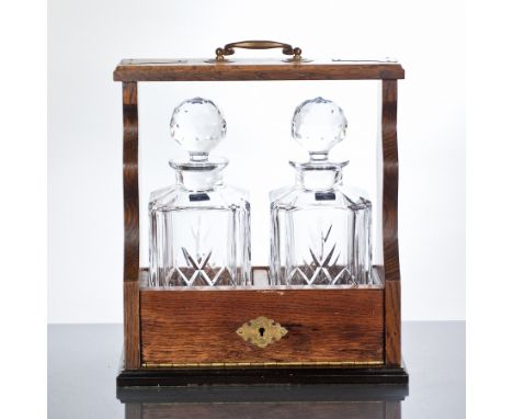 TWO BOTTLE TANTALUS
Wooden Tantalus with two Royal Worcester crystal decanters. CONDITION REPORT: Good.