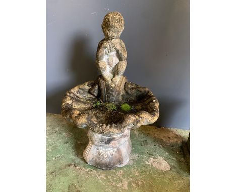 A low bird bath with a boy playing a pipe (H90cm)