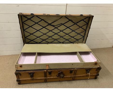 A wooden and metal bound trunk with tray insert (W110cm D55cm)