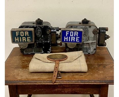 Two vintage Argo taxi cab meters along with a British Rail bag 