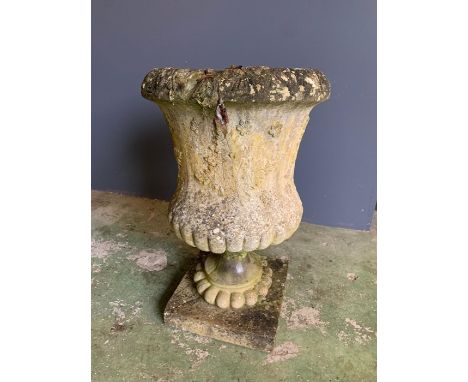 An urn planter on base 