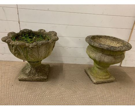 Two stone garden planter on plinths 