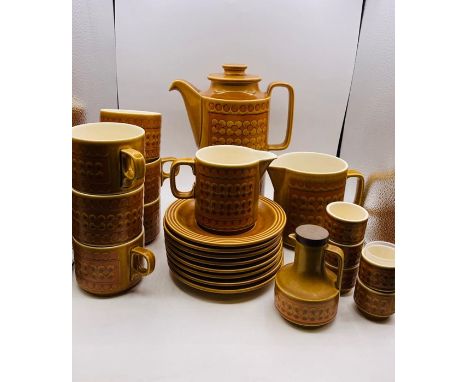 A 1970's Hornsea Pottery "Saffron" tea service to include, six cups and eight saucers, tea pot, milk jug, water jug, vinegar 