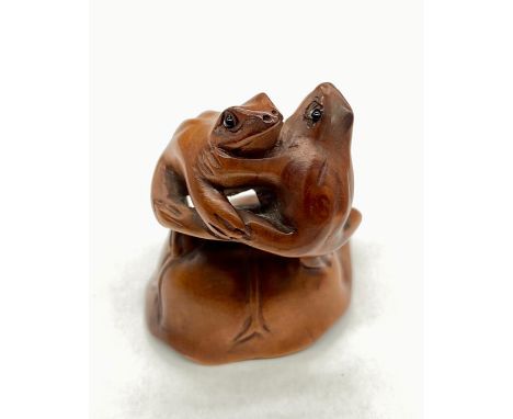 Japanese antique wooden netsuke of two frogs dancing with signature "Ishikawa"