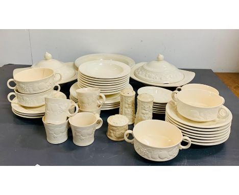 A part set of Royal Worcester Crown Ware dinner service with a fruit decoration around the edge of the china 