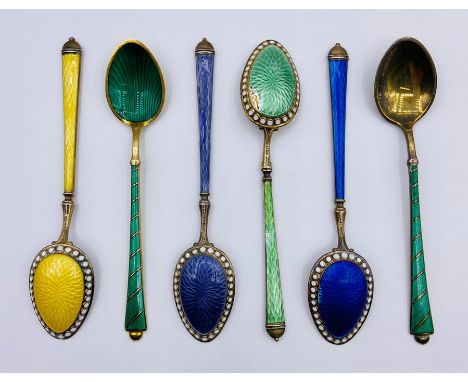 A selection of seven various enamel on silver spoons