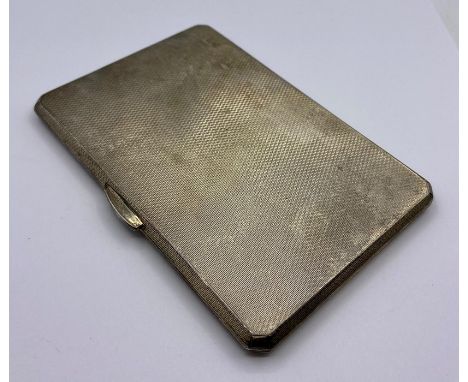 A Birmingham hallmarked cigarette case, machine tooled, dated 1939 makers mark K&amp;D, Kendal and Dent. 