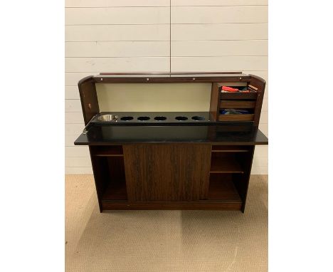 A Mid Century bar with wine bottle holders, ice bucket and serving shelf (H115cm W127cm D40cm)