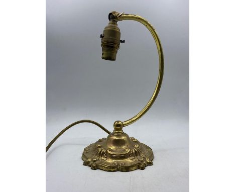 A Cast brass desk or side lamp with no shade.