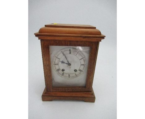 A modern cased striking mantle clock, with square silvered dial, height 11ins
