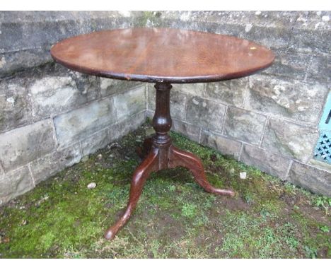 A 19th century oak tilt top tripod table, diameter 31ins x height 28ins