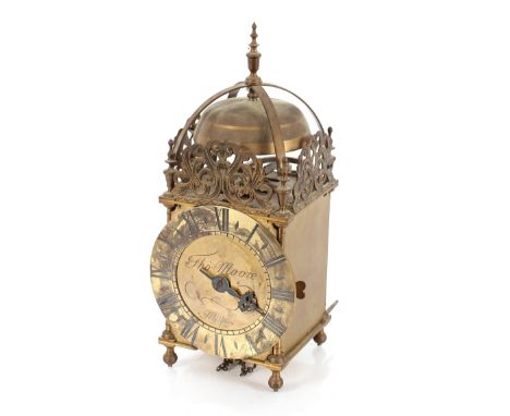 An antique brass lantern clock, having steel chapter ring and brass top bell inscribed Thomas Moore, Melford