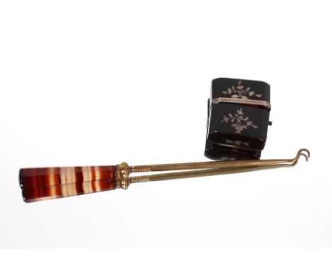 A Victorian tortoiseshell and white metal picquet work needle case and a brass button hook with agate handle&nbsp;