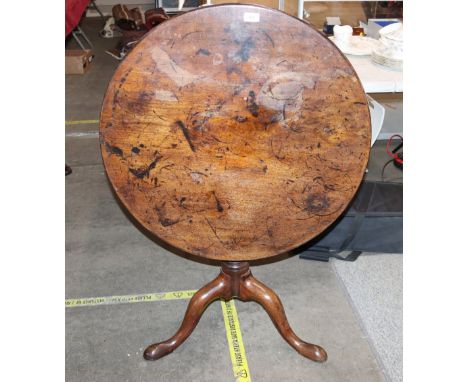 A 19th Century mahogany circular snap top occasional table raised on turned column and tripod base, 74cm dia.&nbsp;