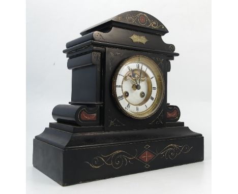 A Victorian black slate striking mantel clock, the enamel and gilt dial with escapement, the architectural case decorated wit