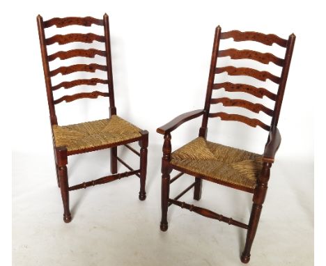 A set of eight (6+2) ladder back North Country dining chairs, with rush seats, raised on turned front legs and turned stretch