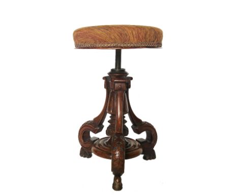 A 19th century mahogany music stool, with revolving adjustable circular top, raised on a turned column with three outswept ca