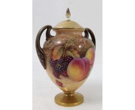 A Royal Worcester covered pedestal vase, hand painted all around with fruit to a mossy background by P Platt, shape number 27